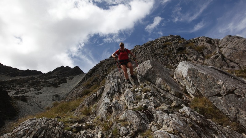 Nicky climbing down steep ridge after Waiau Pass