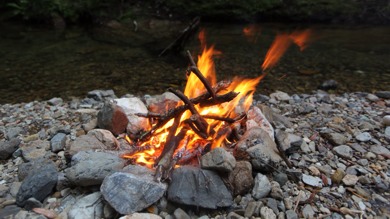 Campfire by stream