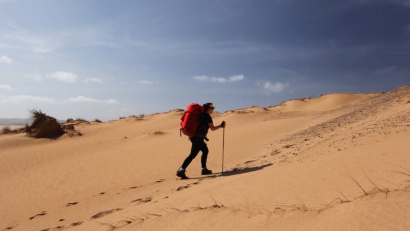 Climbing sandy dunes